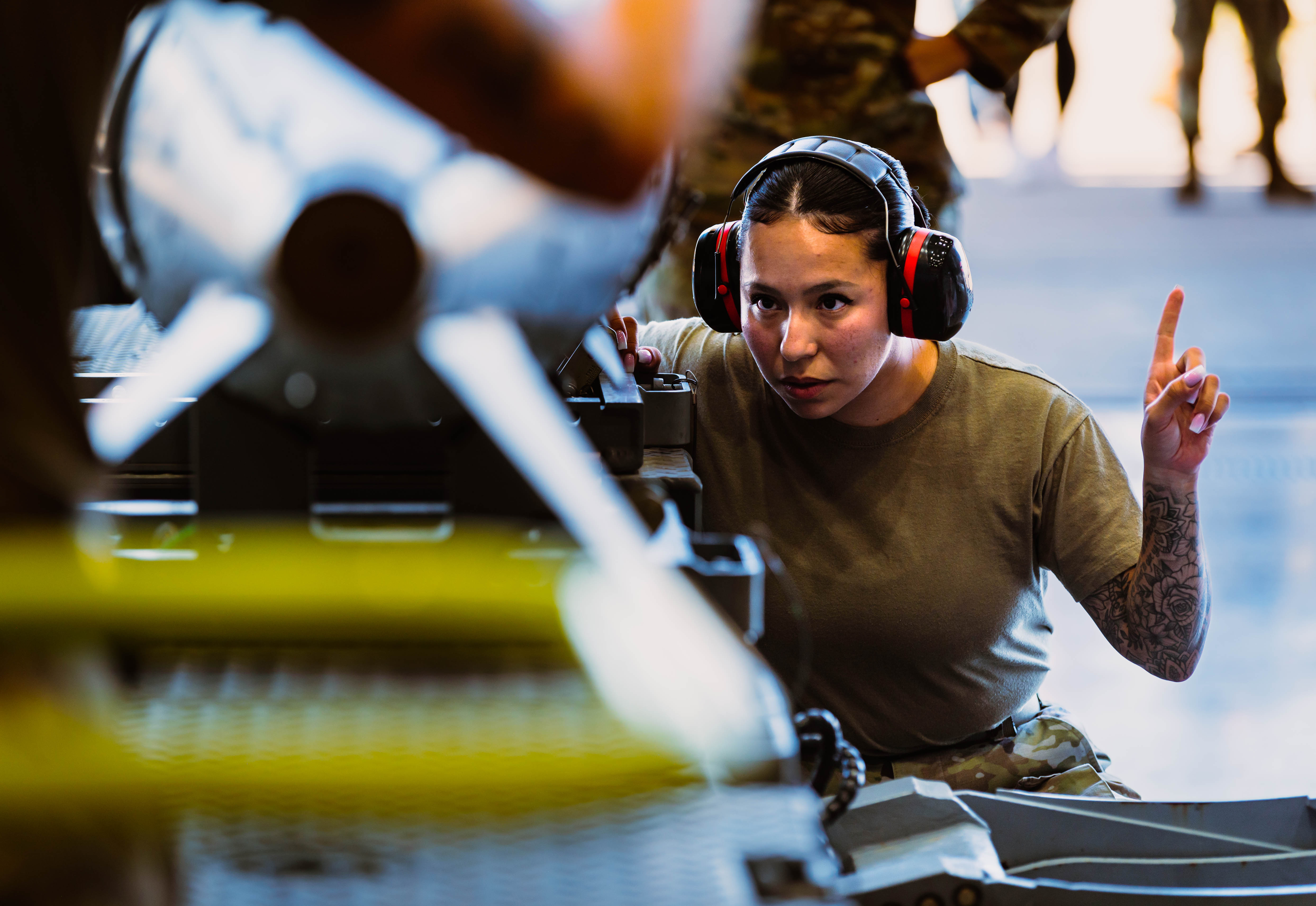 Air Force Staff Sergeant Kiyanna Nichter, 56th Maintenance Group weapons load crew member, secures AIM-9X Sidewinder missile for Air Force F-35A Lightning II during third quarterly weapons load competition, October 6, 2023, at Luke Air Force Base, Arizona (U.S. Air Force/Katelynn Jackson)